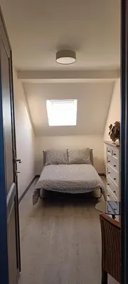 a bedroom with a bed and a dresser and a window at Modern Triplex 140m2 - 4 bedrooms, 1 living room & 2 bathrooms - 8 people in Brussels city in Brussels