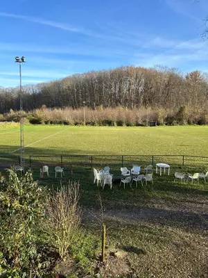 a group of tables and chairs in a field at 't Cravael in Meldert