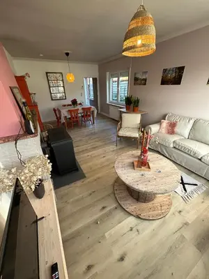 a living room with a couch and a table at 't Cravael in Meldert