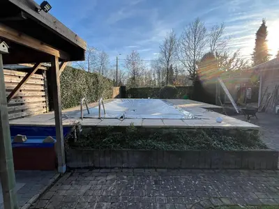 a play area in a yard with a playground at Vakantiehuis De Bosrand Goor-Asbroek in Hulshout