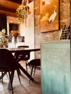 a sign that says the earth has music for those who listen at CASA LAGO gezellige chalet aan het water in Geel