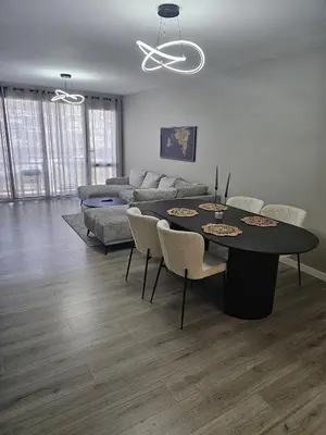 a living room with a table and a couch at Modern Comfort Spot Apartments in Antwerp