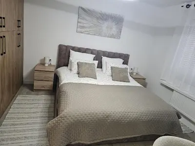 a bedroom with a large bed with pillows at Modern Comfort Spot Apartments in Antwerp