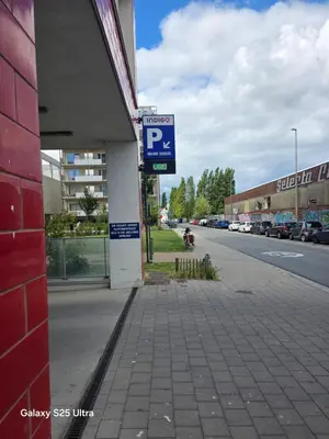 a parking sign on the side of a building at Homeawayfromhomeghent with private parking in Ghent