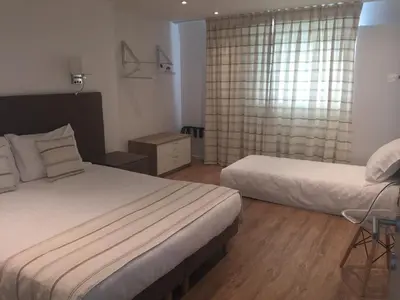 a bedroom with two beds and a window at Shelter-rooms in Buysinghen