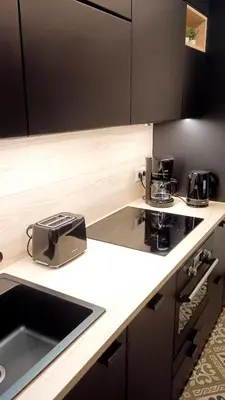 a kitchen with a sink and a toaster on a counter at Royal South II - Stylish apartment in Antwerp Zuid in Antwerp