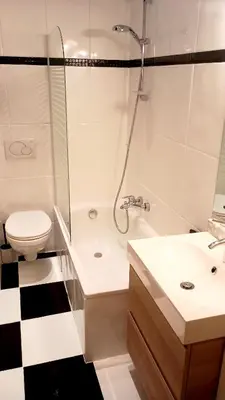 a bathroom with a shower and a toilet and a sink at Royal South II - Stylish apartment in Antwerp Zuid in Antwerp