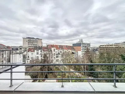 a view of a city from a balcony at Penthouse Cinquantenaire in Brussels