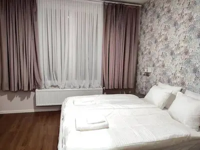 a hotel room with two beds and a window at City Center location 1BR Apartment near Station! in Antwerp