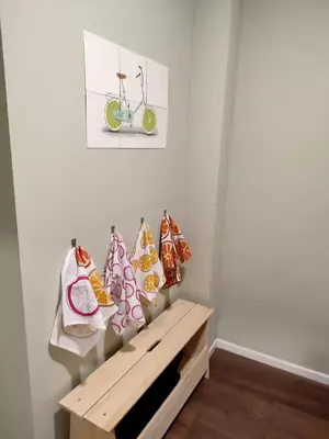 a room with a bench with cushions and a bike on the wall at City Center location 1BR Apartment near Station! in Antwerp