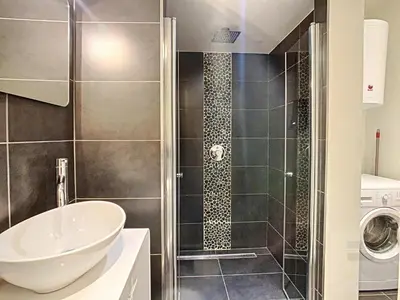 a bathroom with a shower and a sink at Flat Moliere in Brussels