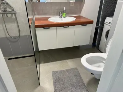 a bathroom with a sink and a toilet at Studio - simply living in Antwerp
