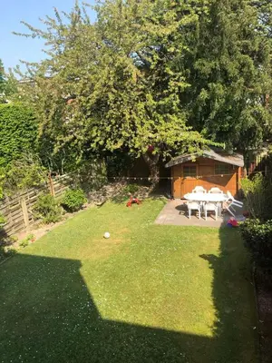 a backyard with a picnic table and a shed at Studio - simply living in Antwerp