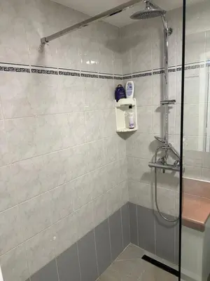 a bathroom with a shower with a glass door at Studio - simply living in Antwerp