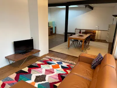 a living room with a couch and a table at Richard XIII in Antwerp