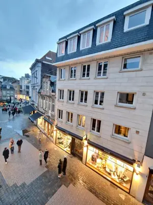 a group of people walking on a street next to a building at Cozy Room, Big City Adventures III in Ghent