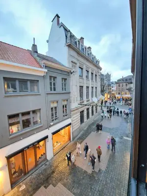 a group of people walking down a street at Cozy Room, Big City Adventures III in Ghent