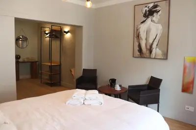 a bedroom with a bed with two towels on it at Cozy Room in the Heart of Ghent I in Ghent
