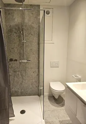 a bathroom with a shower with a toilet and a sink at Charming Room in Ghent center II in Ghent