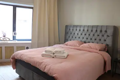 a bedroom with a bed with two towels on it at Charming Room in Ghent center II in Ghent