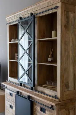 a large wooden cabinet with a glass door at Machelen in Machelen