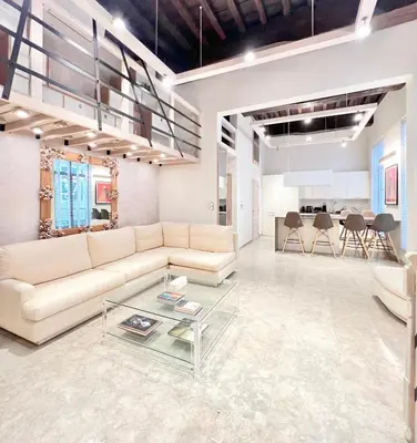 a living room with a couch and a table at Luxury on Rue Haute in Brussels