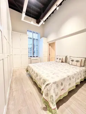 a bedroom with a large bed in a room at Luxury on Rue Haute in Brussels