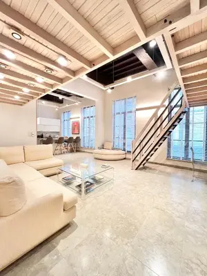 a large living room with a couch and a table at Luxury on Rue Haute in Brussels
