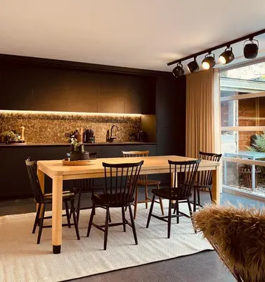 a dining room with a table and chairs in a kitchen at The Studio in Antwerp