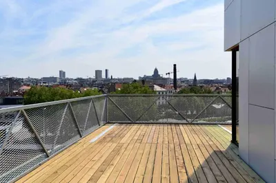 a balcony with a view of a city at Hôtel Belvue in Brussels