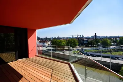 a balcony with a view of a city at Hôtel Belvue in Brussels