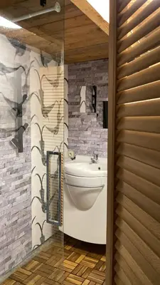 a bathroom with a sink and a toilet in a room at Trees in Assenede