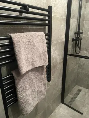 a towel rack with two towels on it in a bathroom at Appartement Brussels Expo in Strombeek-Bever