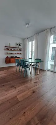 a living room with a ping pong table and chairs at Living Gent in Ghent