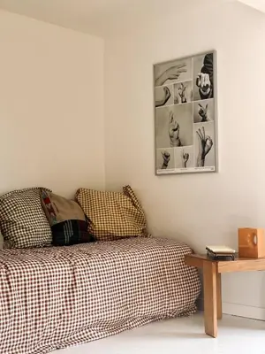 a bedroom with a bed and a picture on the wall at Garden flat in central brussels in Brussels