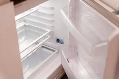 an open refrigerator with its door open and a drawer at BelGem in Antwerp