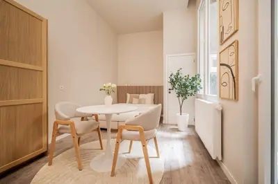 a dining room with a table and chairs at BelGem in Antwerp