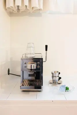 a coffee maker on a counter in a kitchen at Studio Lido by Simone Antwerp in Antwerp