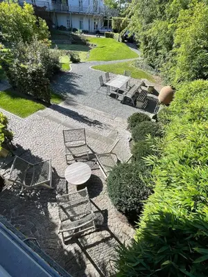 an overhead view of a patio with a table and chairs at Waterfront vacation home in Sint-Amands