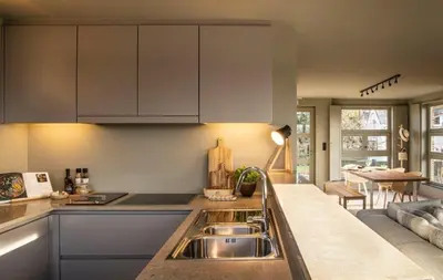 a kitchen with a sink and a counter top at Waterfront vacation home in Sint-Amands
