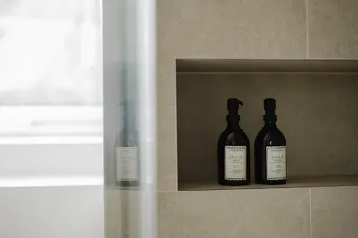 three bottles of wine sitting on a shelf at Apartment in the House of the Harbor Captain in Antwerp