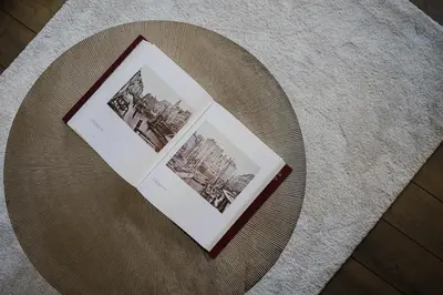a table with two photos on top of a table at Apartment in the House of the Harbor Captain in Antwerp