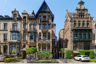 an old building in the city of chicago at Boutique Baron Osy Suite Second Street in Antwerp