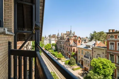 a view of a city from a balcony at Boutique Baron Osy Suite Second Street in Antwerp