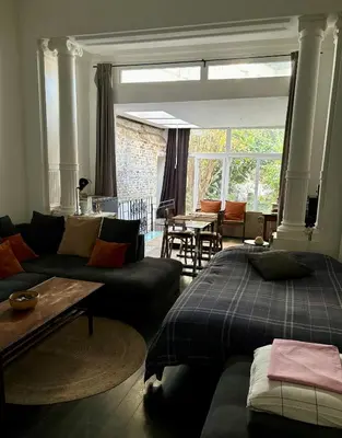 a living room with two beds and a couch at Art Apartment in Brussels