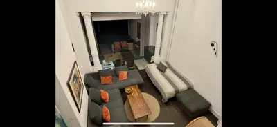 an overhead view of a living room with a couch at Art Apartment in Brussels