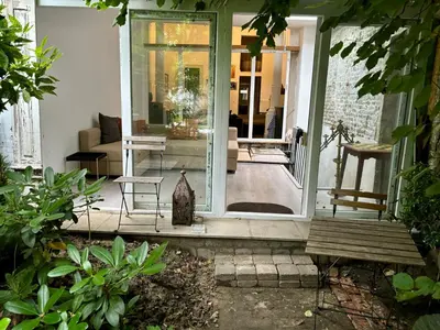 a front porch of a home with a glass door at Art Apartment in Brussels