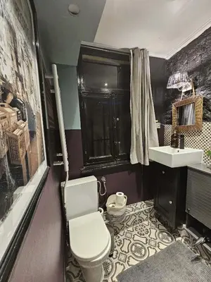 a bathroom with a toilet and a sink at Bruxelles centre petite chambre privée au Sablon ! in Brussels