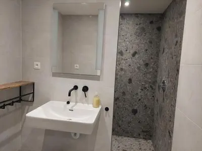 a bathroom with a sink and a shower at Krie1 by Luttelkolen in Tielt