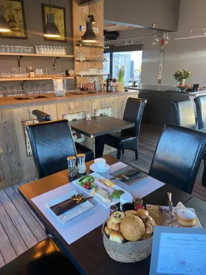 a table with a basket of food on top of it at Escape to Unwind in Putte